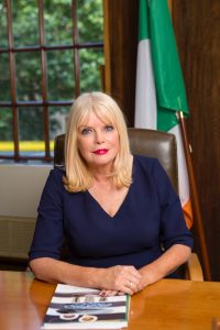 Minister Mitchell O'Connor at desk